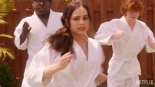 People In White Karate Uniforms Running GIF