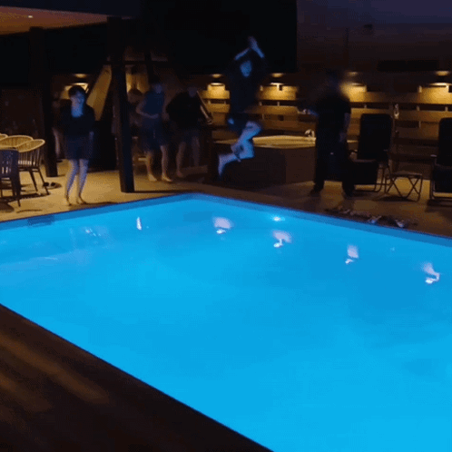 People Jumping Into Pool