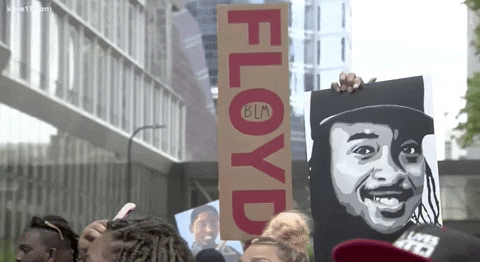 People Lifting Signs Related To George Floyd GIF