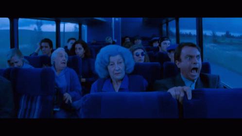 People Looking At Large Red Monster In Dark GIF