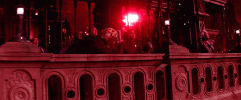 People Looking Up at Red Light