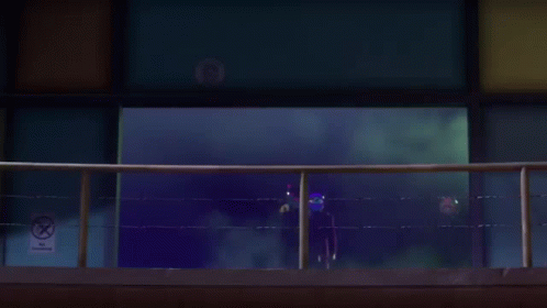 People On Balcony Wearing Masks Including Ox GIF
