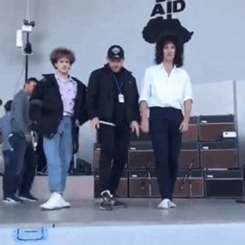 People on Stage Saying Aid