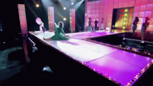 People on Stage with Purple Lights