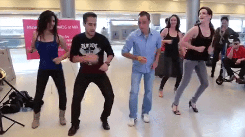 People Performing Salsa At Airport GIF