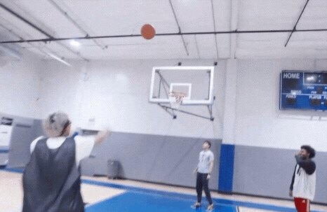 People Playing Basketball In A Gym With A Scoreboard That Says Home On It GIF