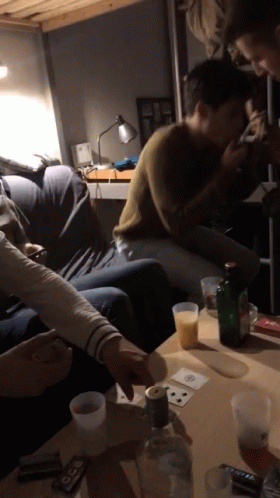 People Playing Cards With Vodka