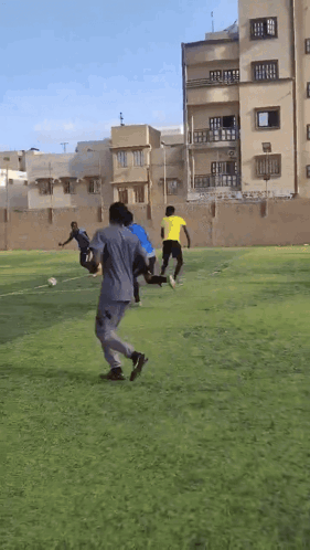 People Playing Soccer Near Building