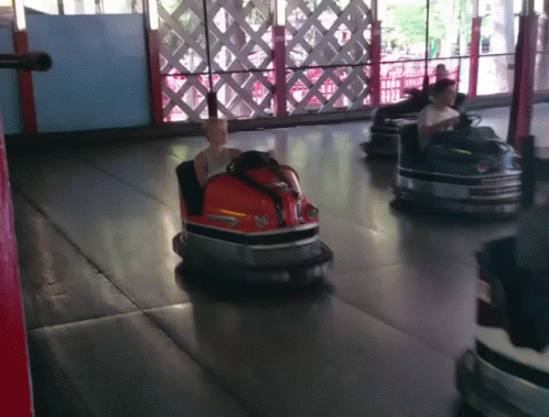 People Riding Bumper Cars With Ford