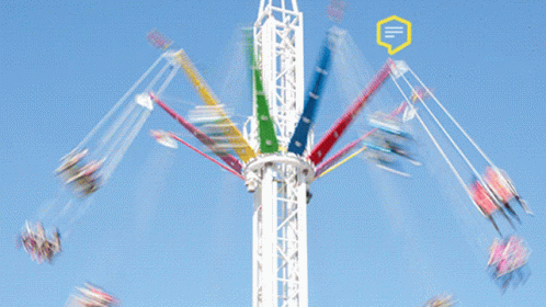 People Riding Ferris Wheel with A Sign