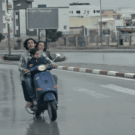 People Riding Scooter at La Guarimba Film Festival
