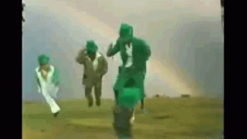People Running In Field With Green Gas Masks