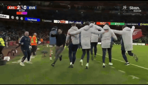 People Running on Soccer Field With Facebook Guinness TCL