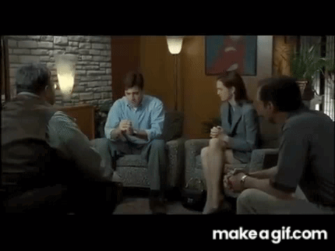 People Sitting Around Table in Living Room