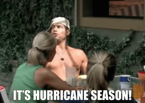 People Sitting Around Table Saying It's Hurricane Season
