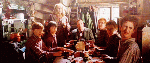 People Sitting at Table With Food Plates