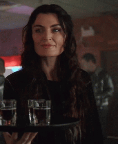 People Sitting At Table With Red Sign GIF