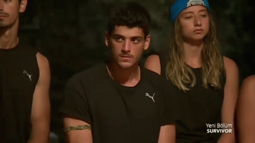 People Sitting in a Row with Blue Beanie