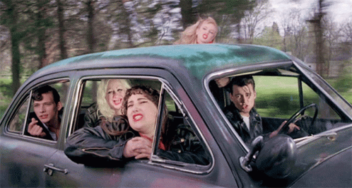 People Sitting In Car With Heads Out Window GIF
