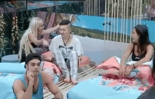 People Sitting On Couch By Pool GIF