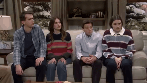 People Sitting on Couch in Living Room