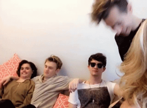 People Sitting on Couch with Sunglasses