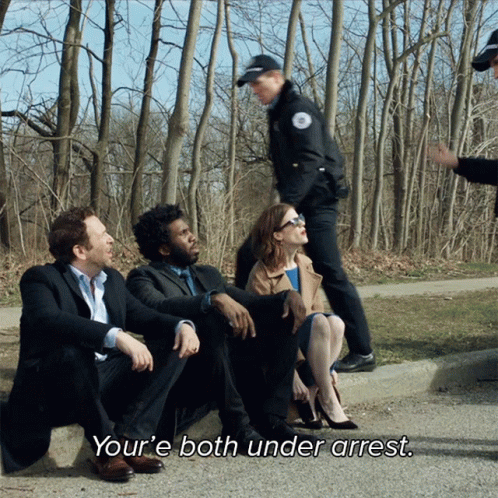 People Sitting On Road One Says Youre Both Under Arrest GIF
