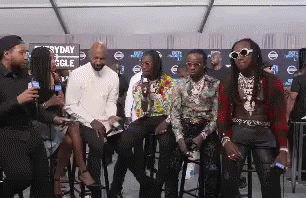 People Sitting on Stools Talking