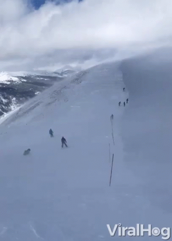 People Skiing Down Snow Slope