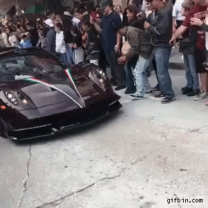 People Standing Around Black Sports Car With Gifbin.com GIF