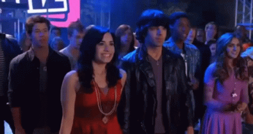People Standing In Crowd At Party GIF