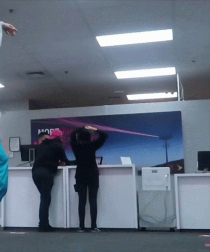 People Standing In Front Of A Sign That Says Hop GIF