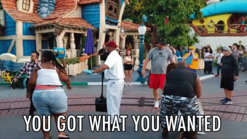 People Standing in Front of Building Saying You Got What You Wanted