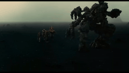 People Standing in Front of Monster