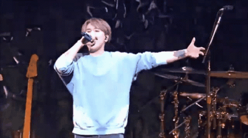 People Standing In Front Of Stage GIF