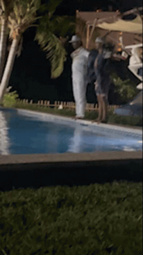 People Standing Next To Pool GIF