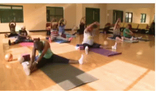 People Stretching in Gym
