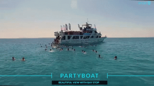 People Swimming Near Party Boat GIF