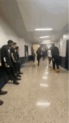 People Talking in Hallway