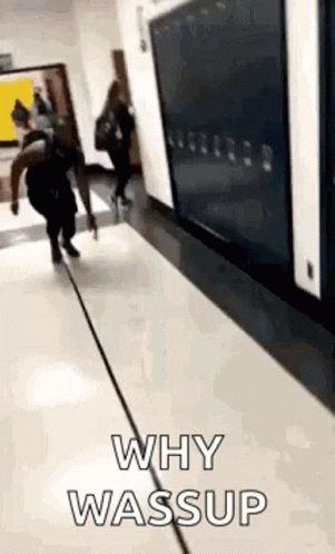 People Walking Down Hallway With Why Wassup