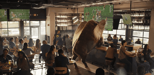 People Watching Football In Restaurant GIF