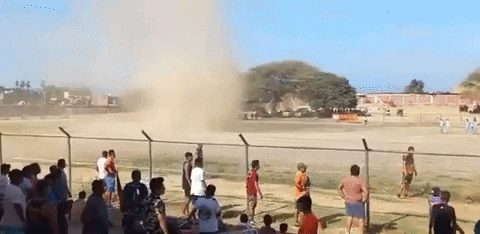 People Watching Soccer Dust Storm GIF