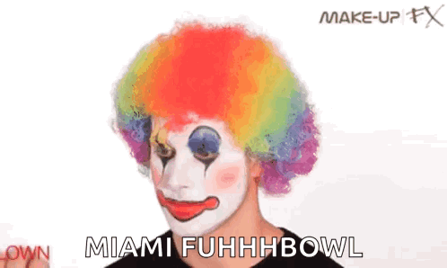 Person Applying Makeup to Clown
