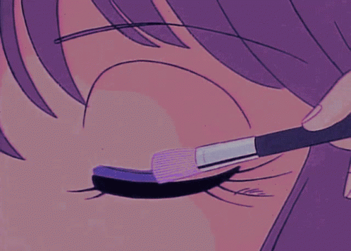 Person Applying Mascara to Eye