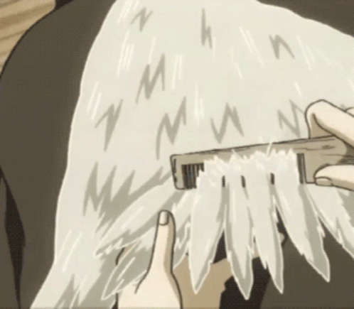 Person Brushing Hair With M Comb GIF
