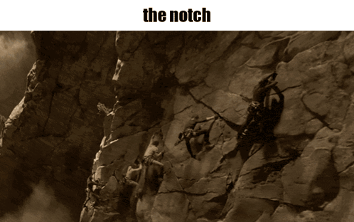 Person Climbing Rock Wall The Notch