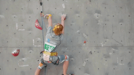 Person Climbing Wall With Number 128 Shirt GIF