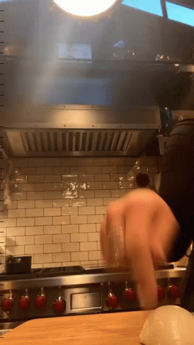 Person Cooking On Wolf Stove GIF