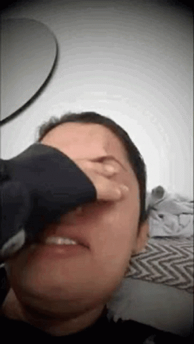 Person Covering Face With Hand