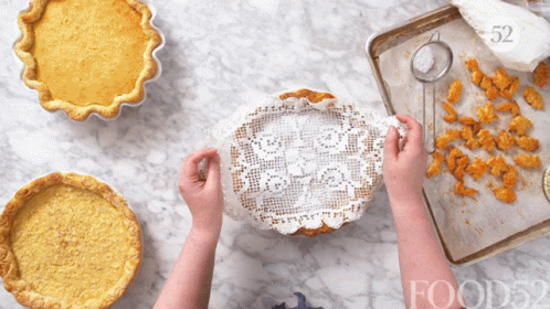 Person Covering Pie With Lace Napkin Number 52 GIF